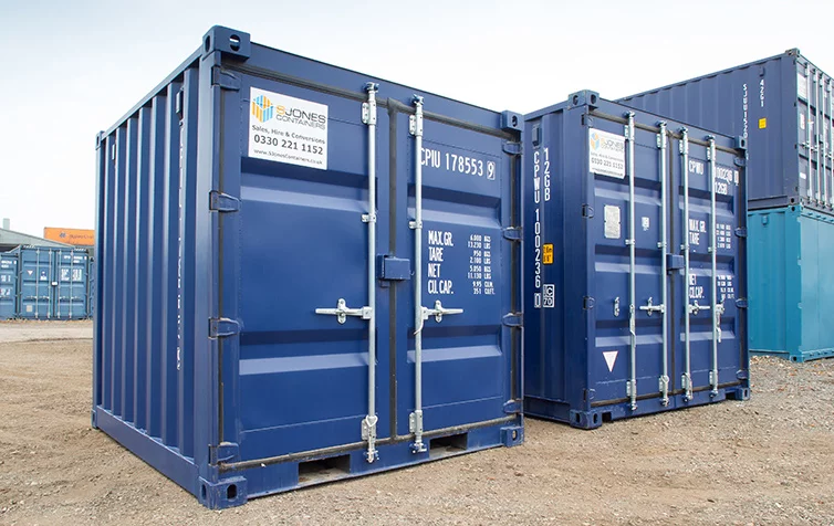 Two Blue 10ft Shipping Containers With Closed Doors