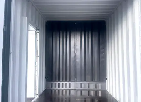 Interior of a high cube container with a removable bulkhead featuring an extra panel at the bottom.