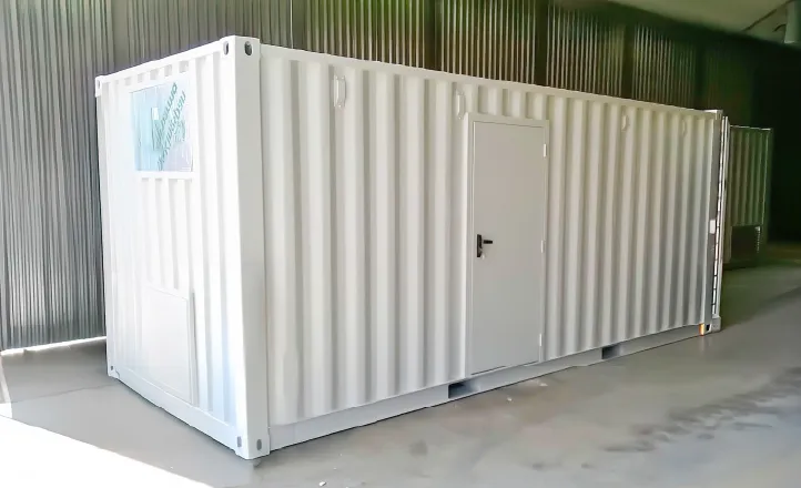 Side view of a clean white container with a secure personnel door, used to house boiler systems.